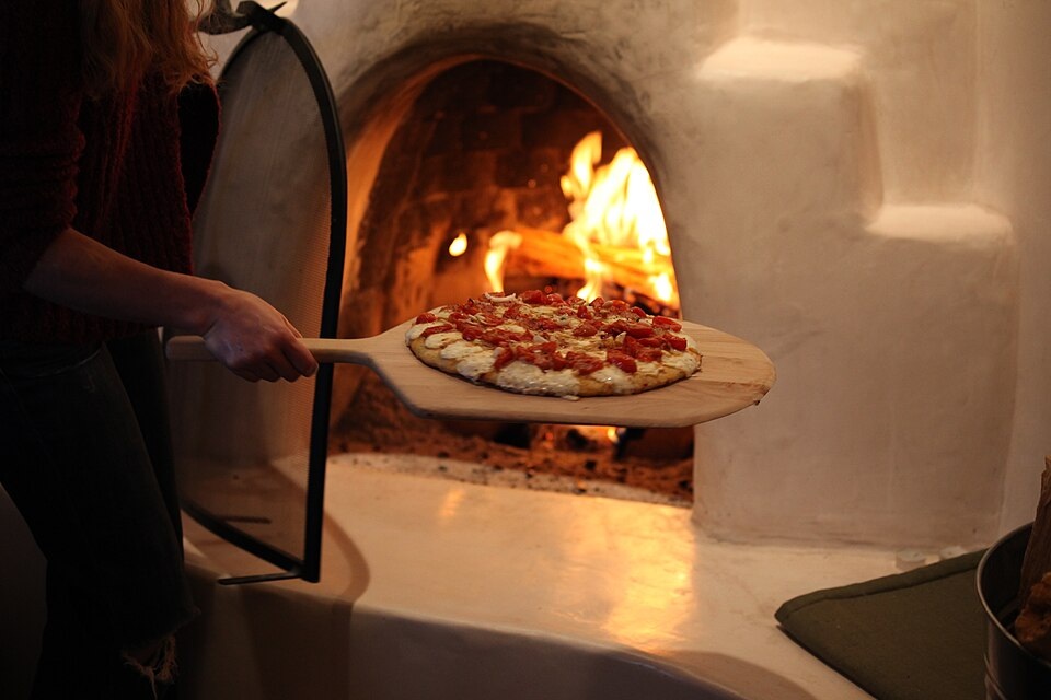 A cake baking in a hot, glowing oven
